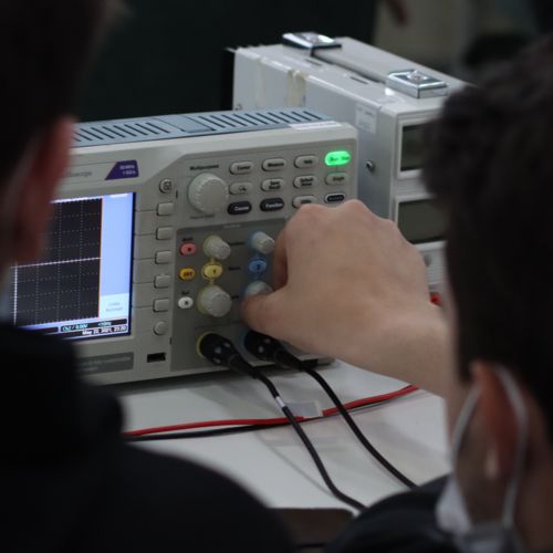 Dragan adjusting the oscilloscope