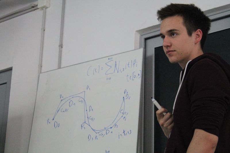 Mihailo performs some calculations on the board
