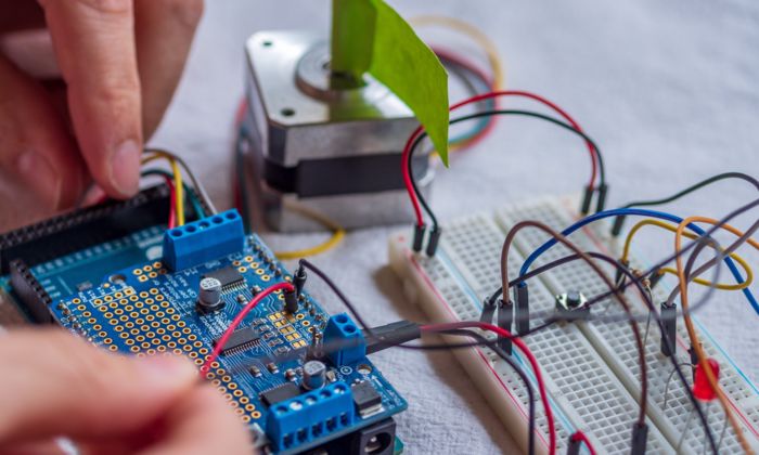 Assembly of a circuit thta includes a microcontroller, prototype board, LED and buttons